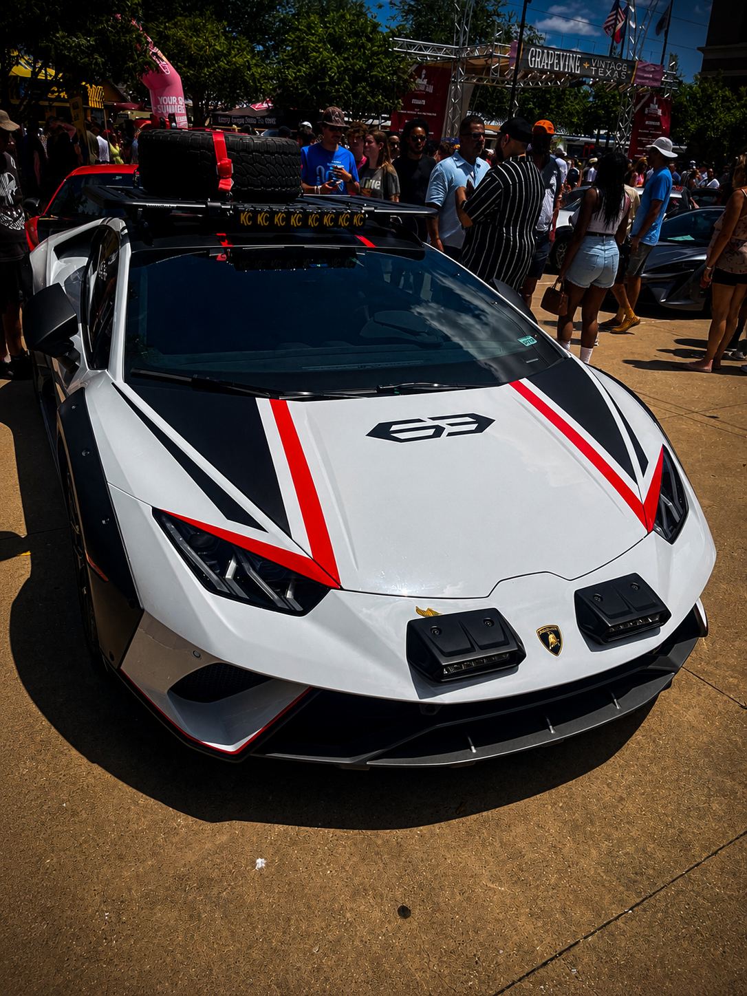 White and red Lamborghini at a car meet